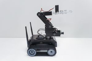 Side view of a robotic arm on a tracked mobile platform