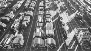 Overhead view of shipping containers in a busy port terminal